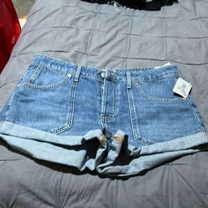 NWT we the free denim shorts. Never worn. Pet friendly home.